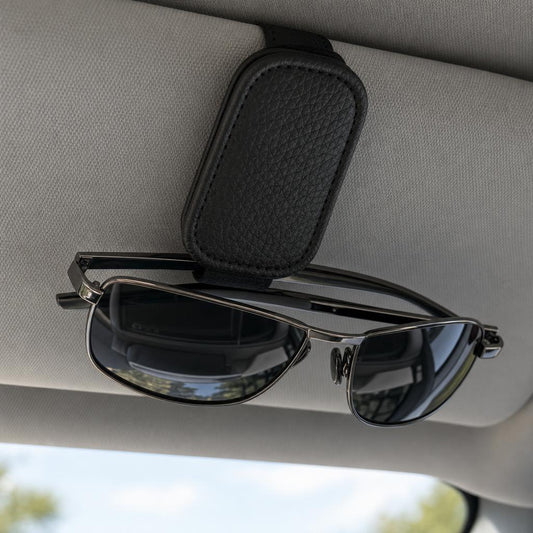 Magnetic visor sunglasses holder on a car sun visor